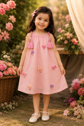 Girl wearing pink tasseled sundress with bow charm details - Aatish Kids