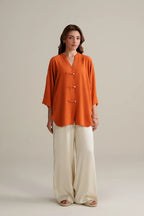 Burnt Orange Top with Ivory Trousers