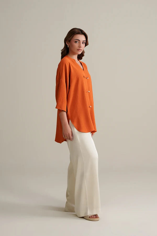 Burnt Orange Top with Ivory Trousers