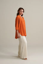Burnt Orange Top with Ivory Trousers