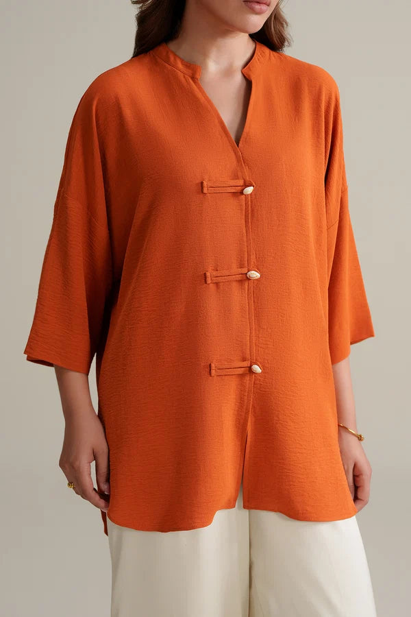 Burnt Orange Top with Ivory Trousers