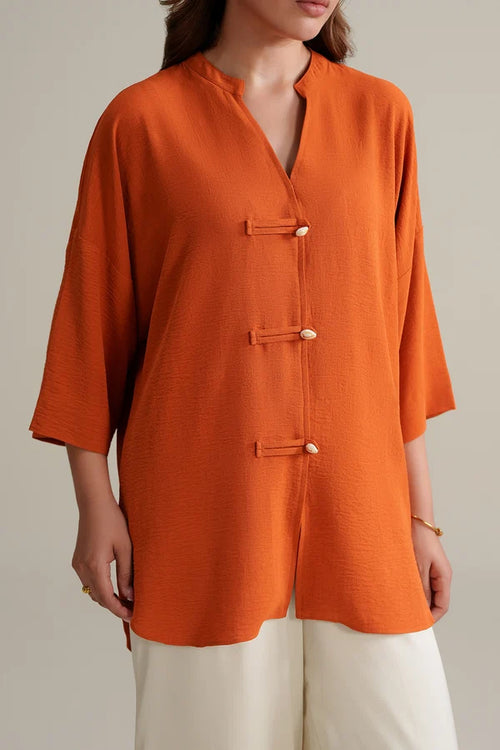 Burnt Orange Top with Ivory Trousers