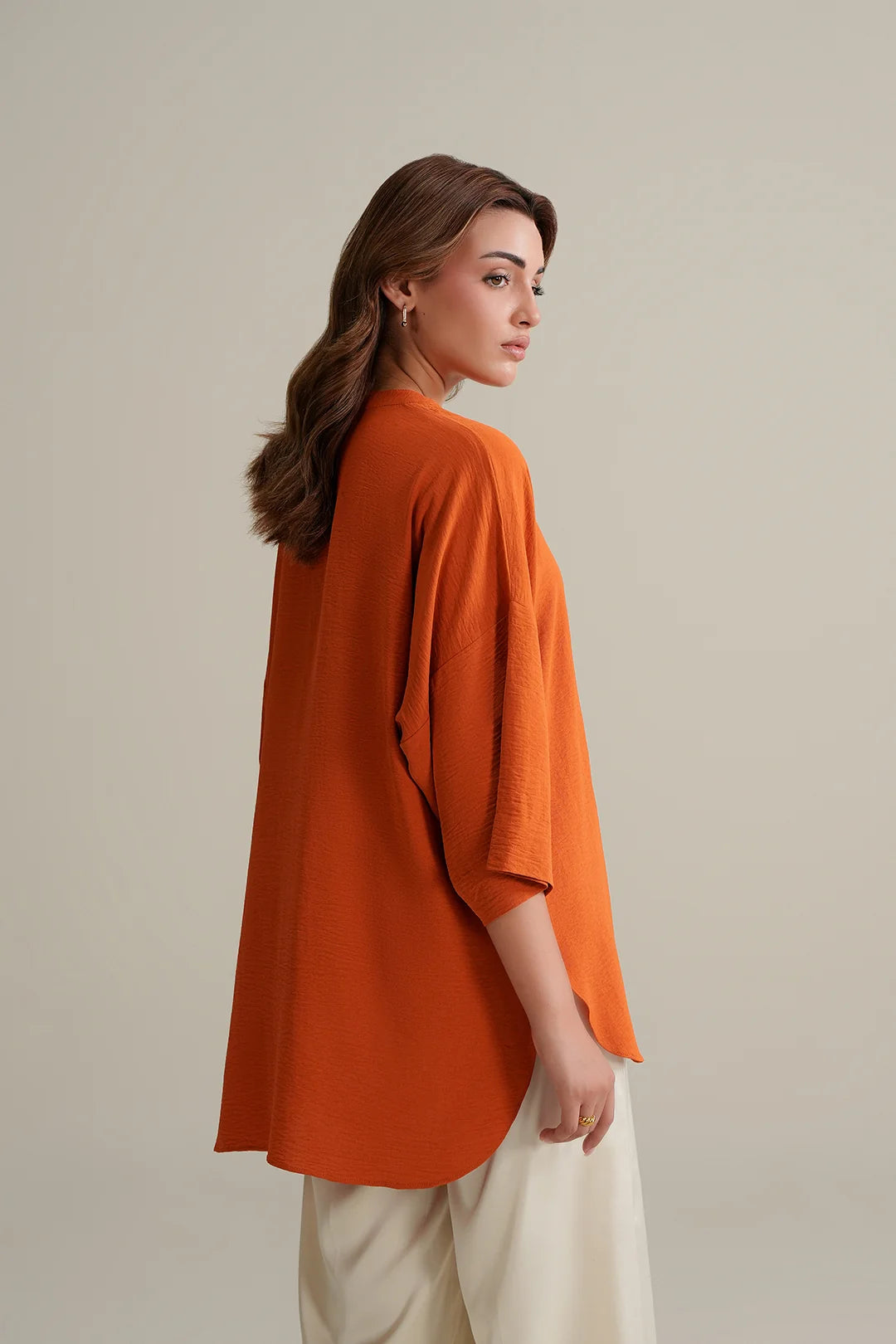 Burnt Orange Top with Ivory Trousers