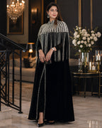 Black silk designer gown styled for gala event, front view