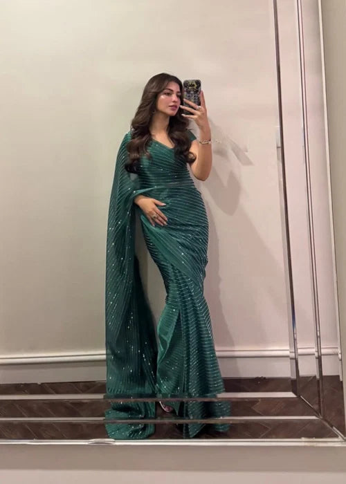 Sparkling green party wear saree styled for evening event