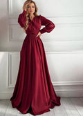 Woman wearing burgundy V-neck knotted silk maxi dress, front view